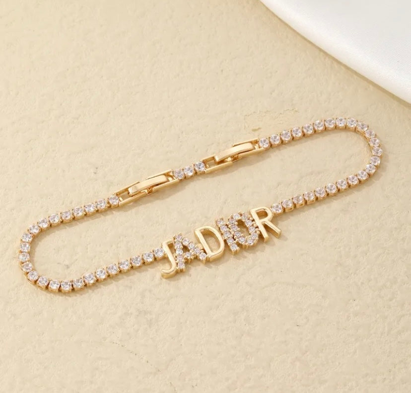Gold iced out jaDior bracelet