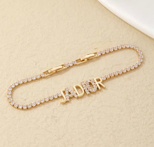 Gold iced out jaDior bracelet